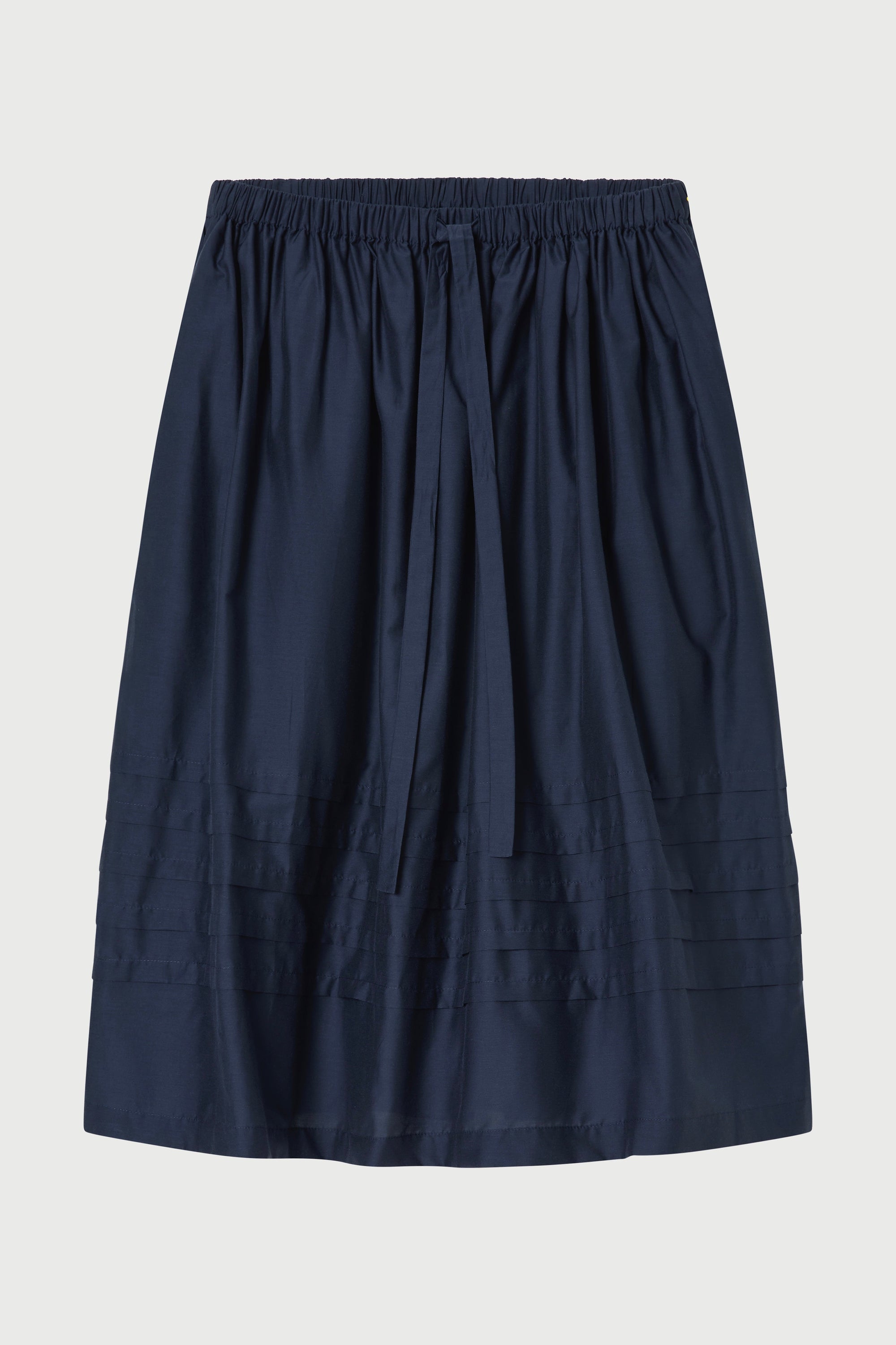 Navy blue skirt on a light gray background