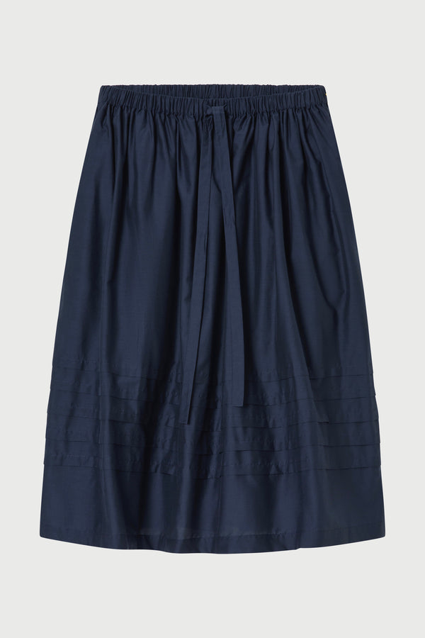 Navy blue skirt on a light gray background