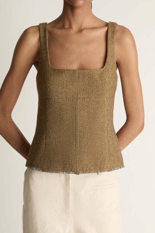 Close up image of a woman wearing the Esme top in a nutmeg brown colour on a white background