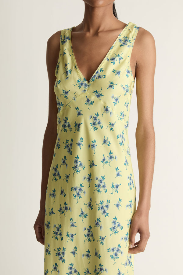 Close-up image of a woman wearing the Maisie Silk Slip dress on a white background background