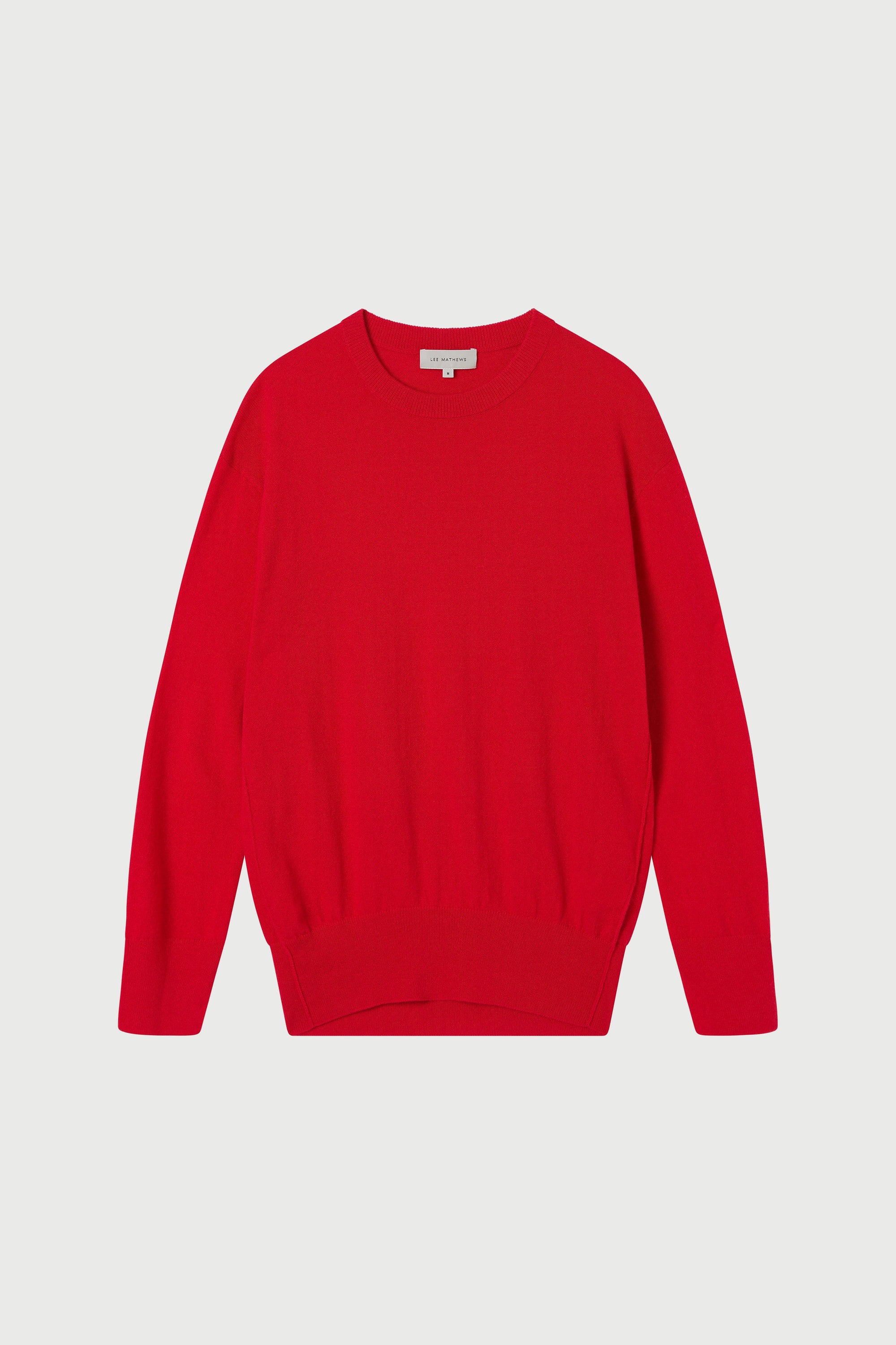 Red sweater on a light gray background